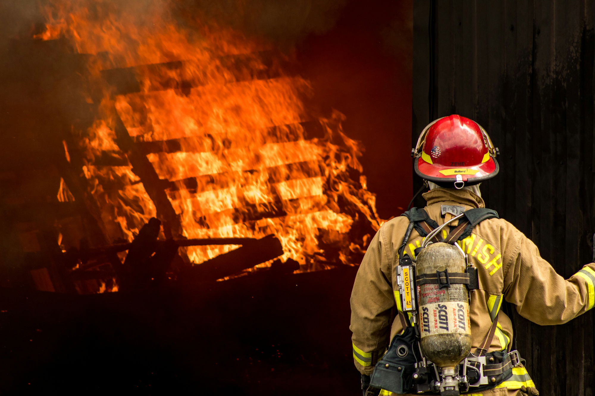 fireman-looking-at-fire.jpg fireman looking at fire